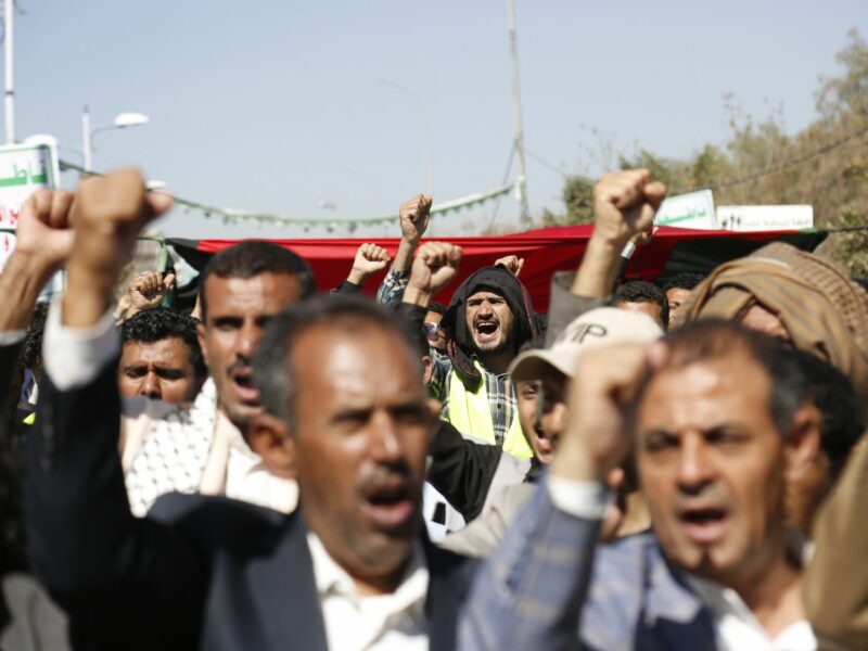 People take part in a protest staged to condemn the U.S.-led strikes on Yemen and in solidarity with Palestinians, in Sanaa, Yemen,