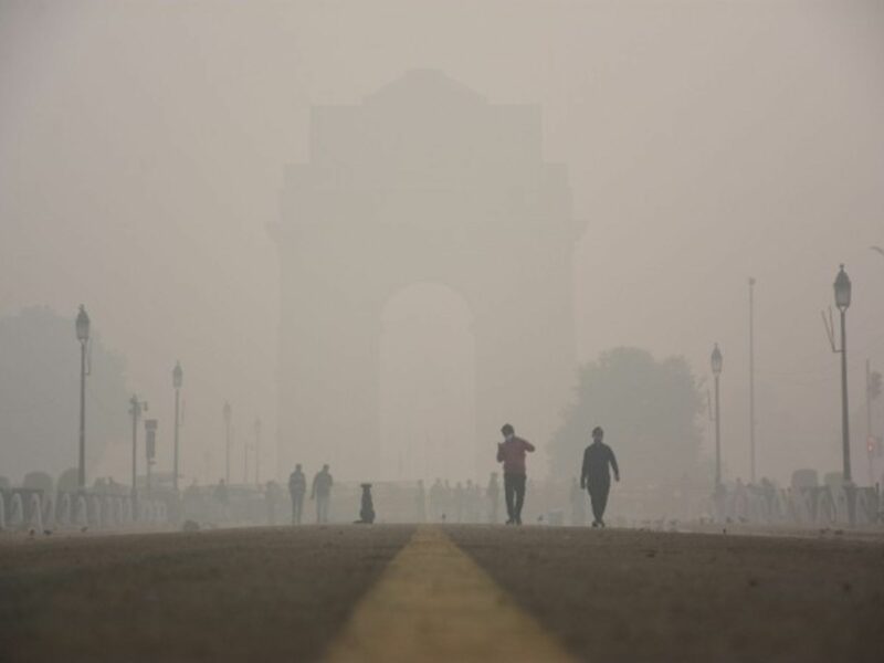 People walking amid heavy smog in New Delhi