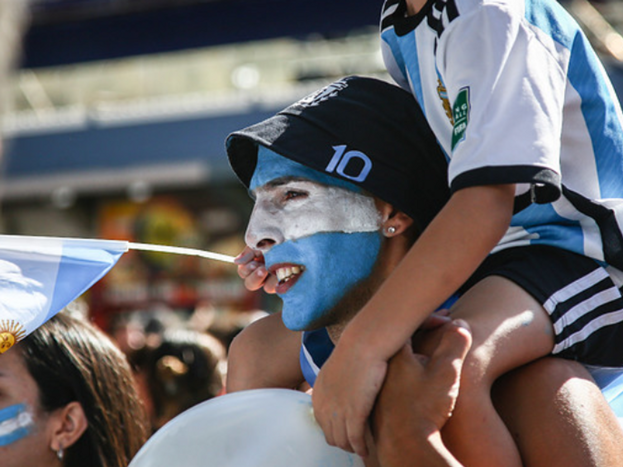 People waving Argentinian flags