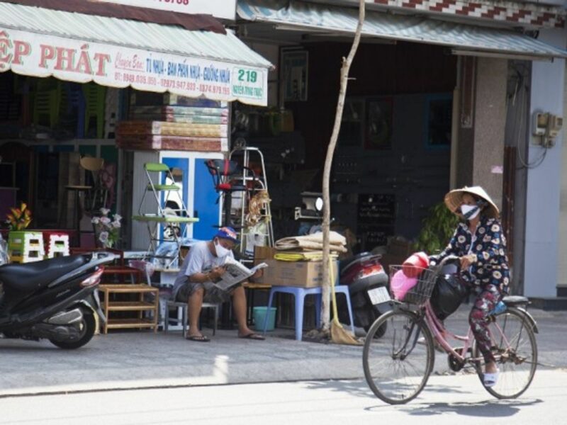 People wear face masks in Vietnam's southern Kien Giang province.