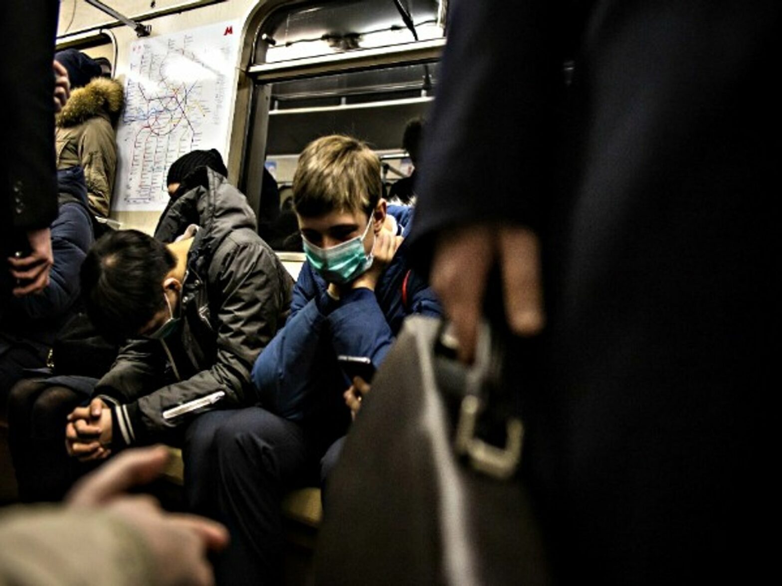 People wearing face mask in fear of flu in metro of Moscow