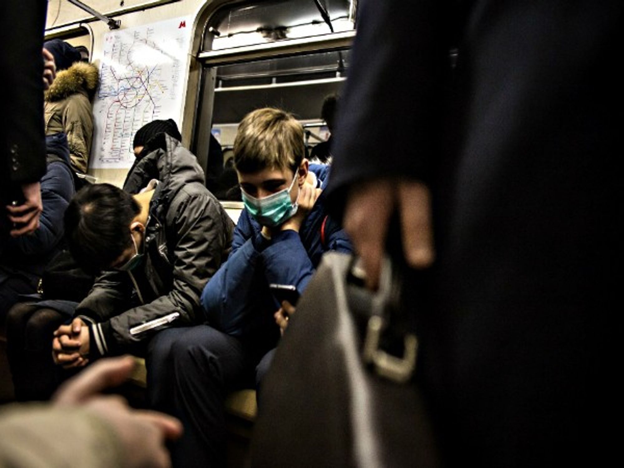 People wearing face mask in fear of flu in metro of Moscow
