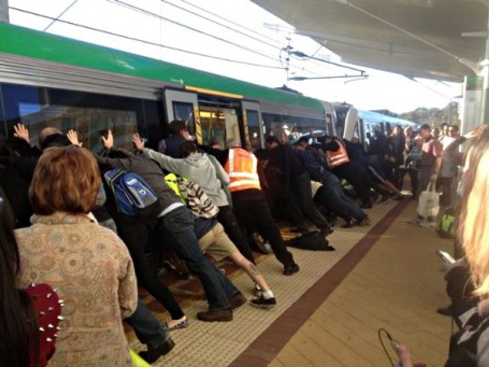Perth commuters team up to free a trapped passenger