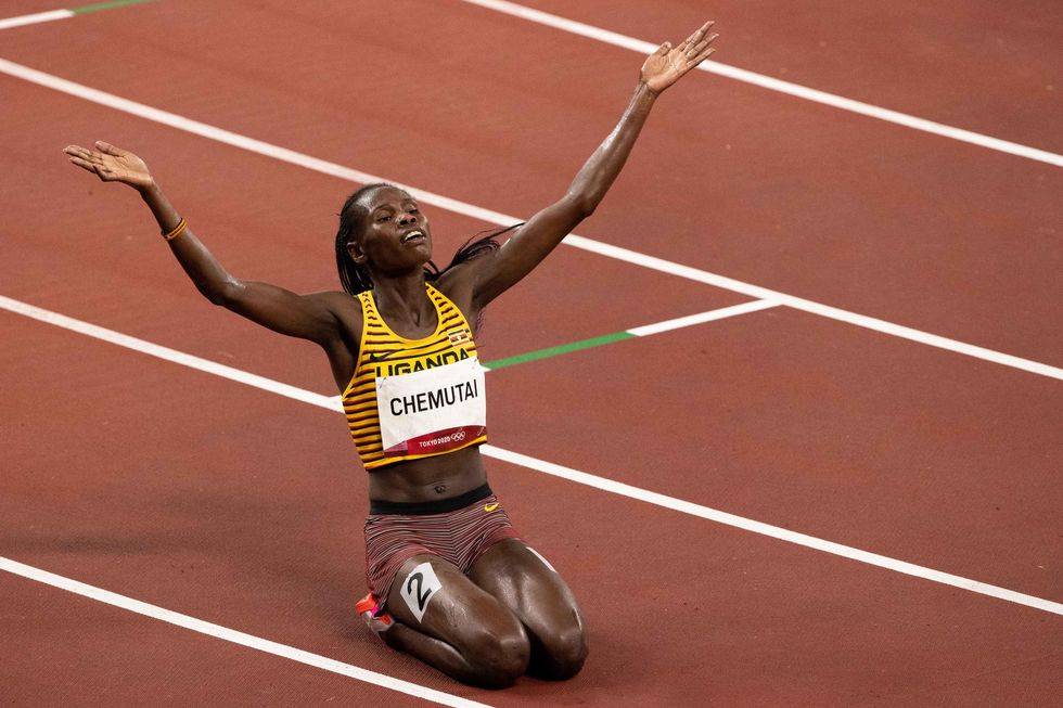 Peruth Chemutai celebrates winning a Gold Medal during the Tokyo 2020 Olympics​