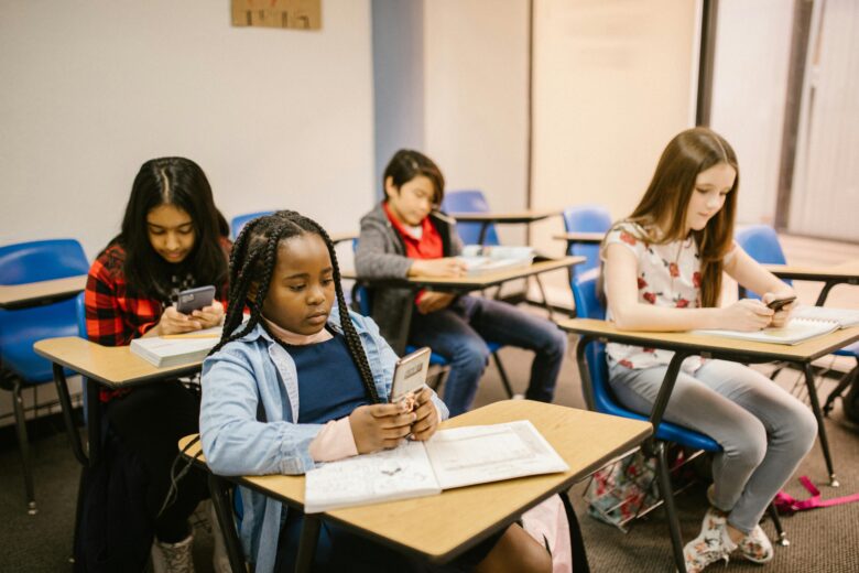 Kids on their phones at school.