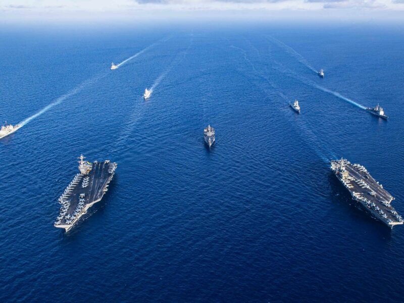 photo from air of navy ships in formation