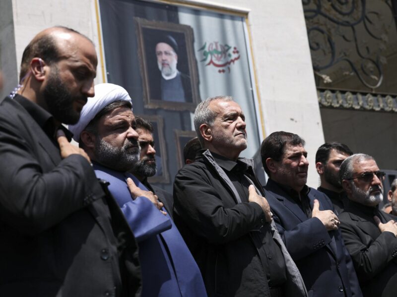 photo of 5 men praying