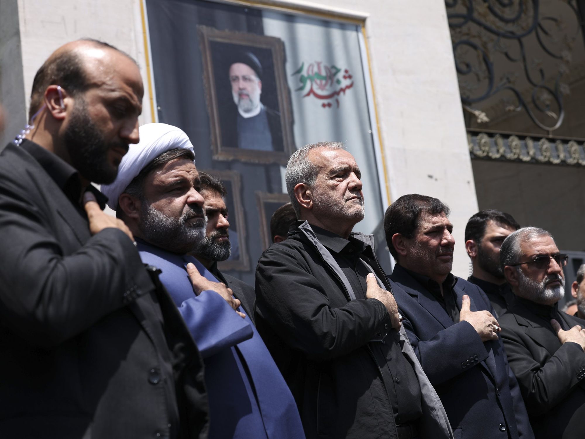 photo of 5 men praying