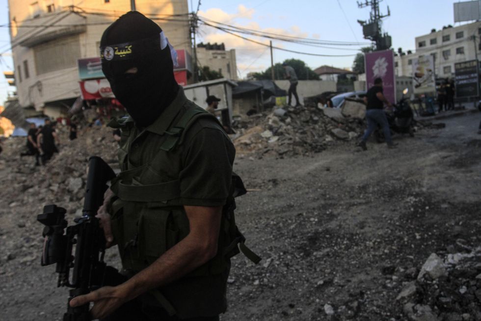 Photo of a A masked Palestinian gunman in Jenin on Sept. 4.