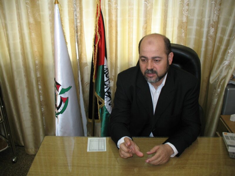 photo of a bearded man at a desk