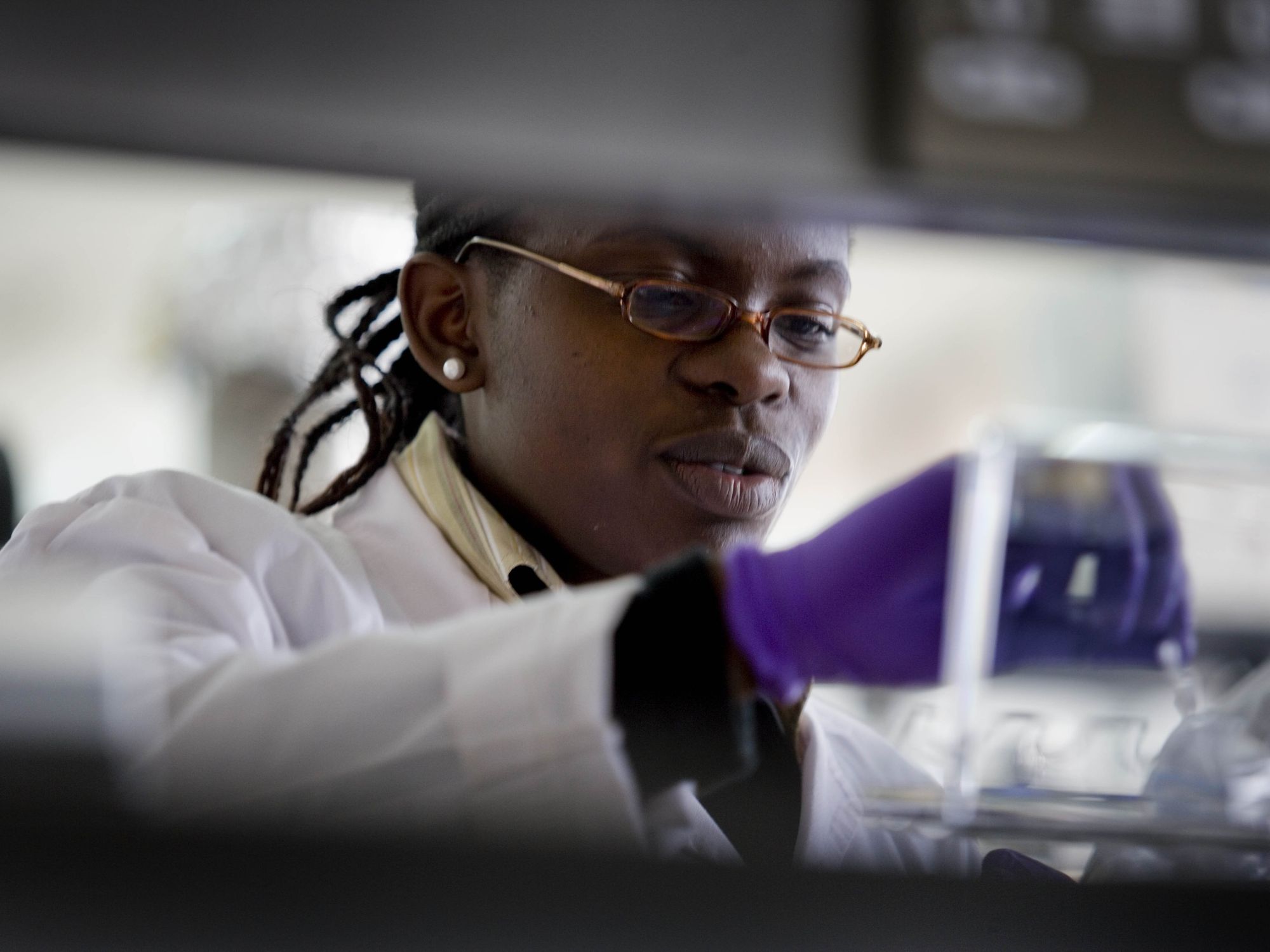 Photo of a Black researcher working in a lab