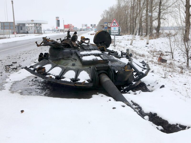 photo of a blown-up tank in snow