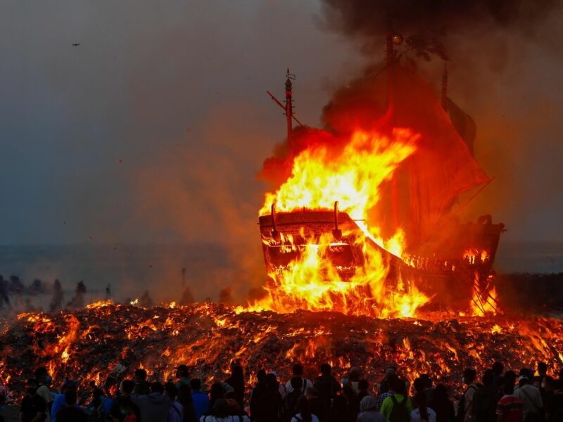 Photo of a boat set on fire as part of the Wangye Worshiping Ceremony, also known as the Donggang King Boat Ceremony, a triennial festival in Donggang, western Taiwan.