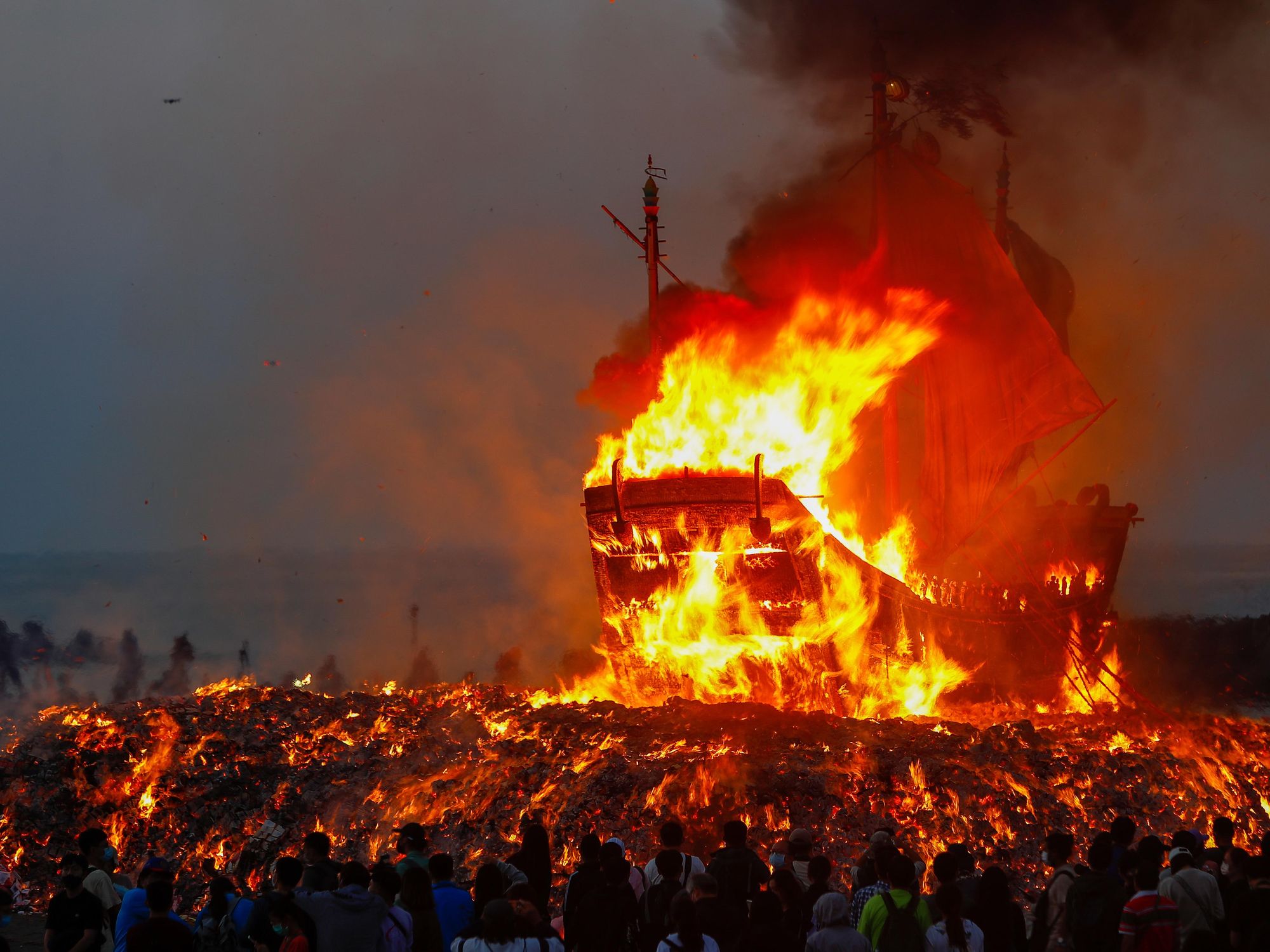 Photo of a boat set on fire as part of the Wangye Worshiping Ceremony, also known as the Donggang King Boat Ceremony, a triennial festival in Donggang, western Taiwan.