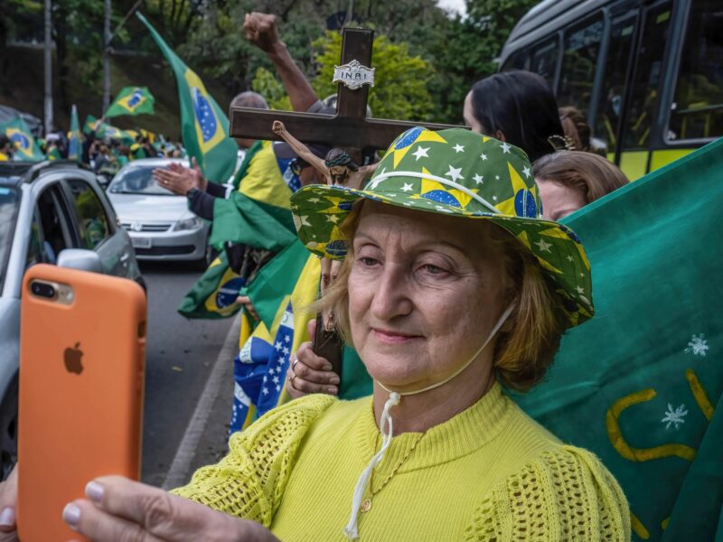 Photo of a Bolsonaro supporter holding a phone