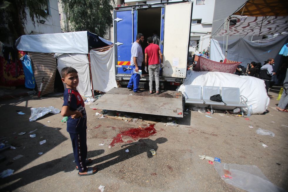 photo of a boy near pool of blood