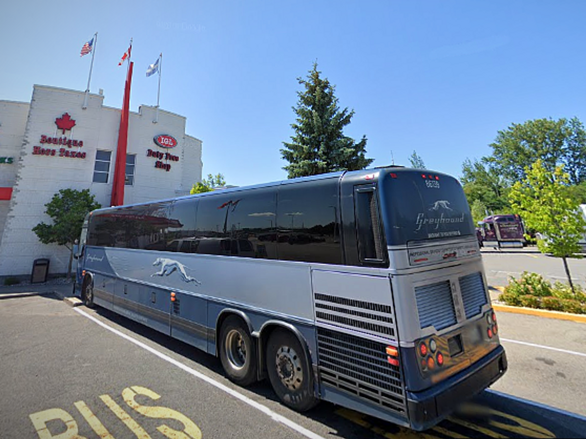 Photo of a bus at the border between the U.S. and Canada
