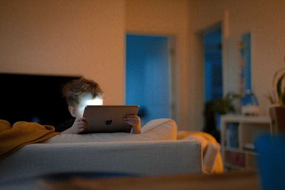 Photo of a child on an iPad.