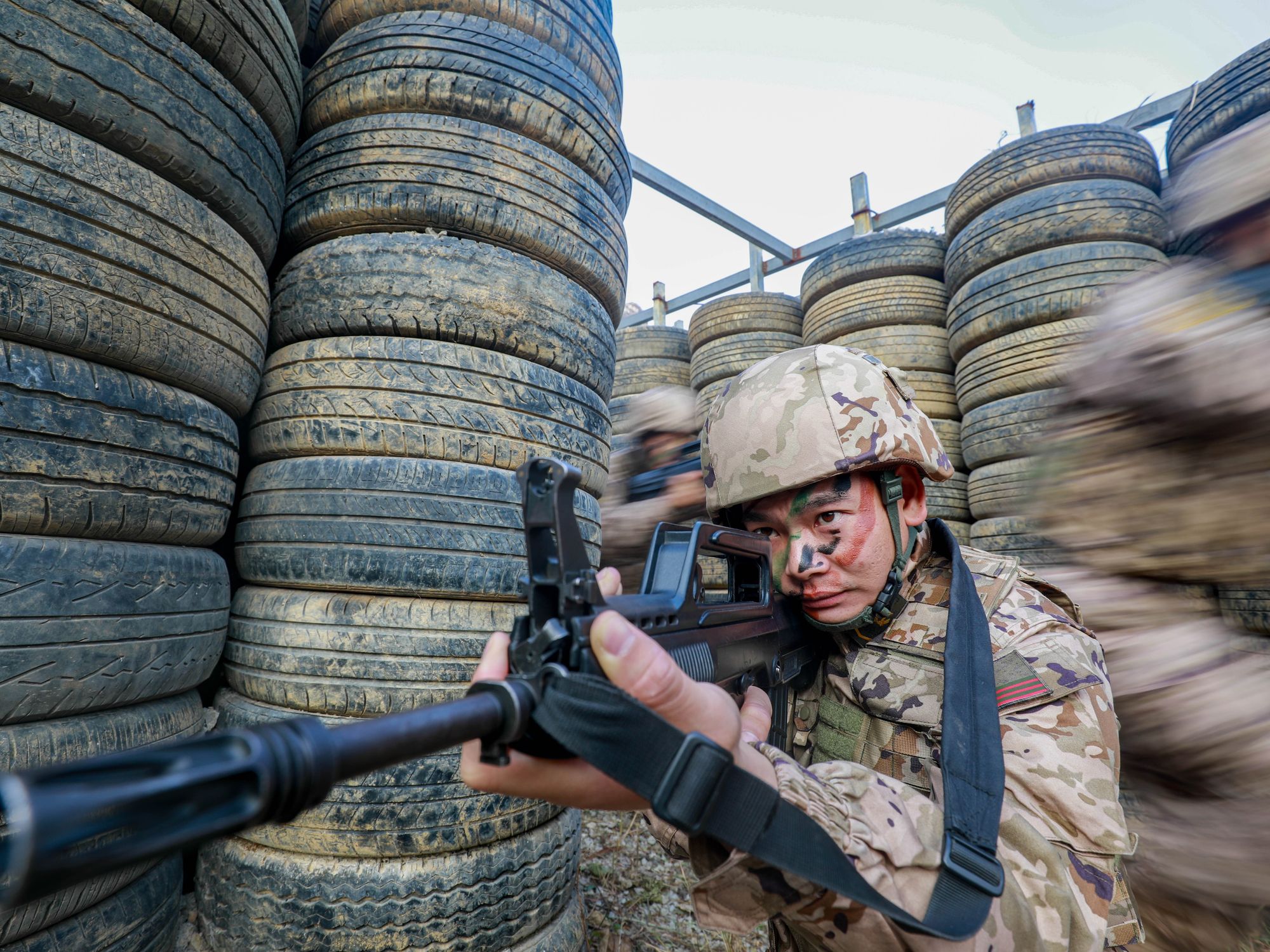 photo of a chinese soldier holding a gun
