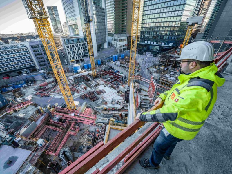 Photo of a construction manager overlooking a construction site in Germany