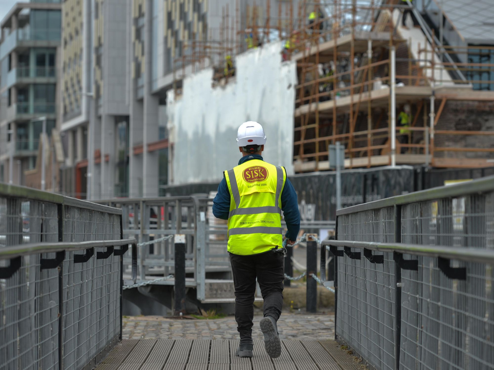 photo of a construction worker in Dublin walking away