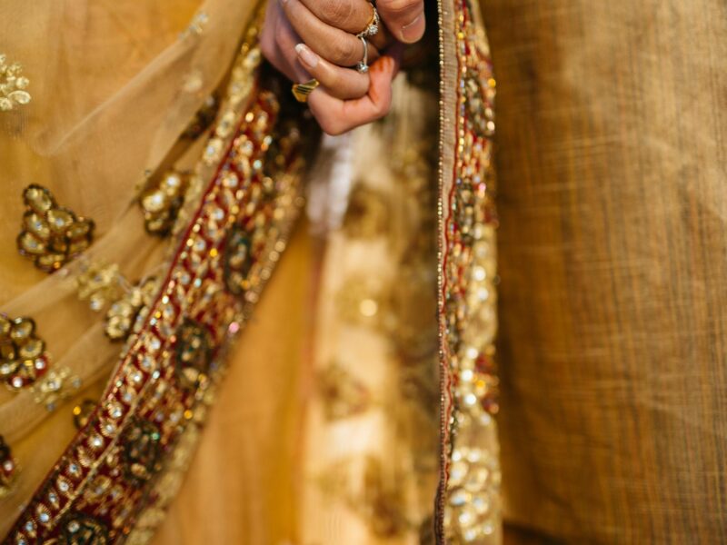Photo of a couple holding hands after a wedding ceremony