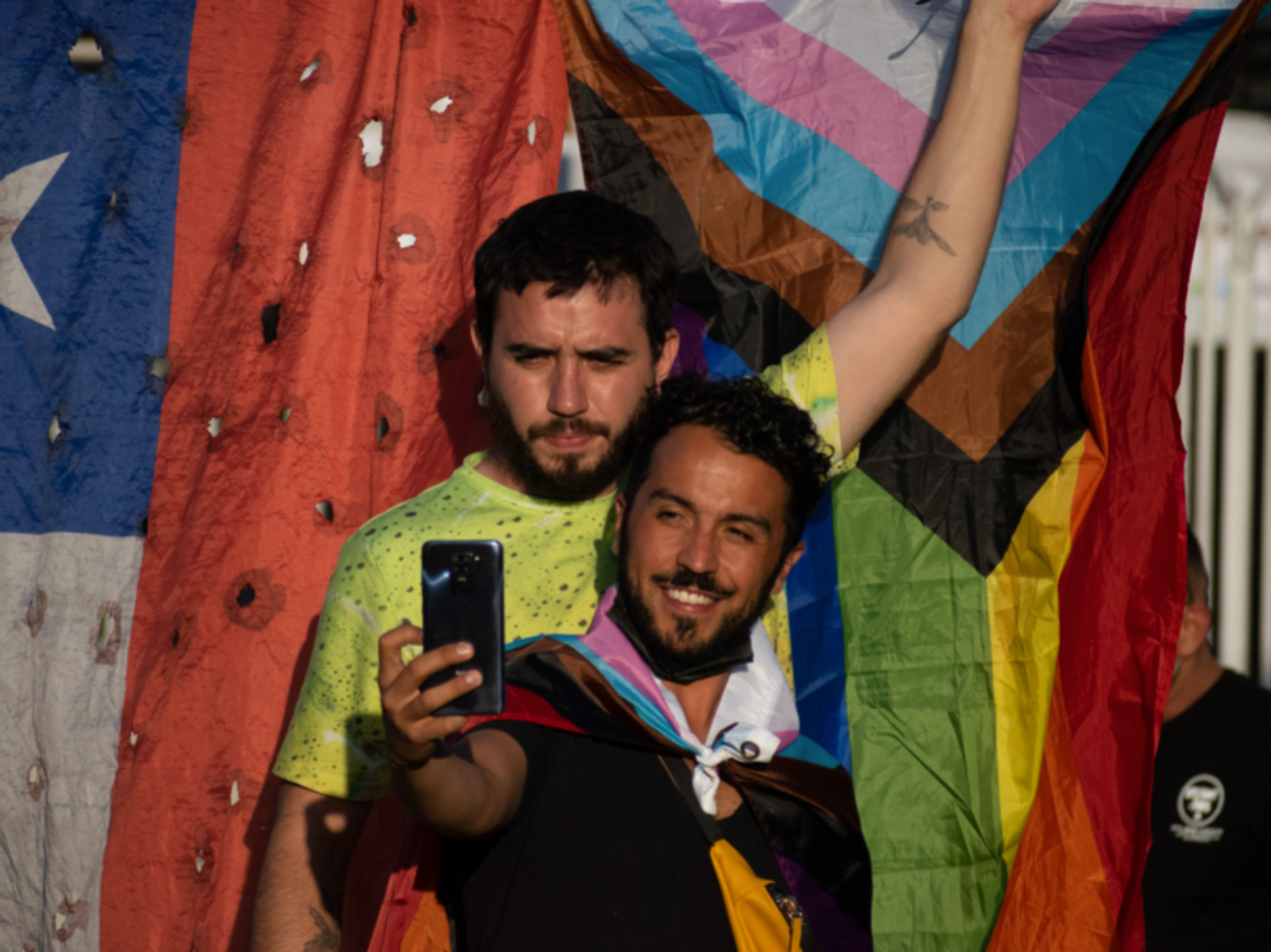 Photo of a couple taking a selfie to celebrate Chilean lawmakers’ decision to approve same-sex marriage, a landmark victory for gay rights activists in the historically Catholic country.