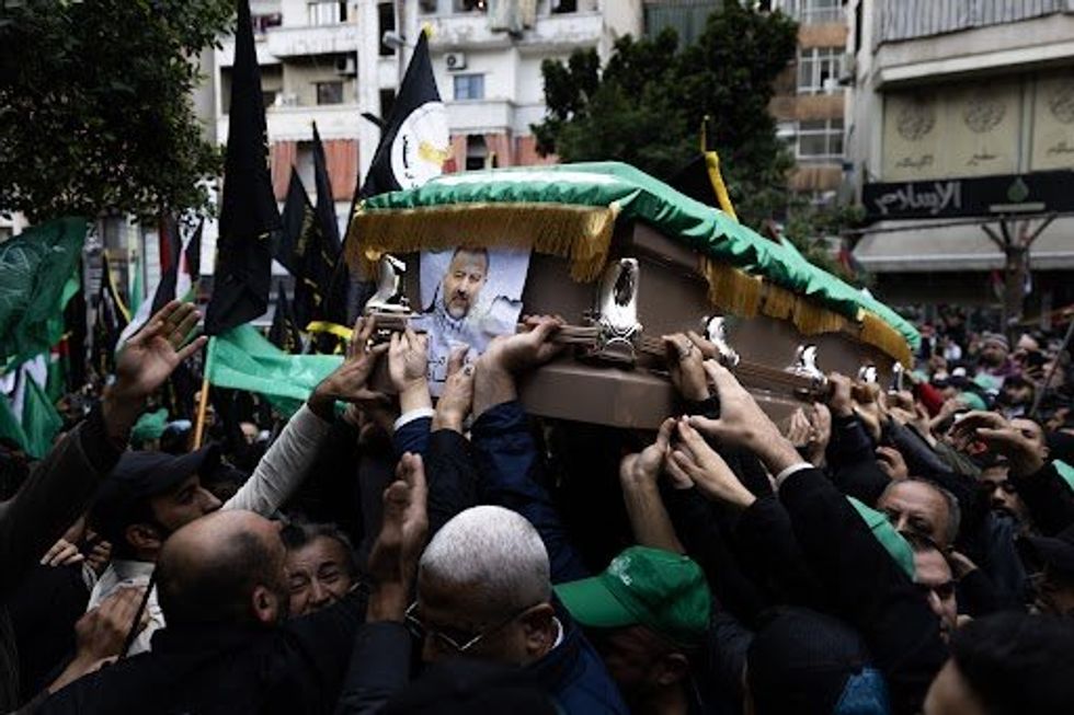 Photo of a crowd at the funeral of Saleh al-Arouri, deputy chief of Hamas's political bureau, in Beirut, Lebanon.