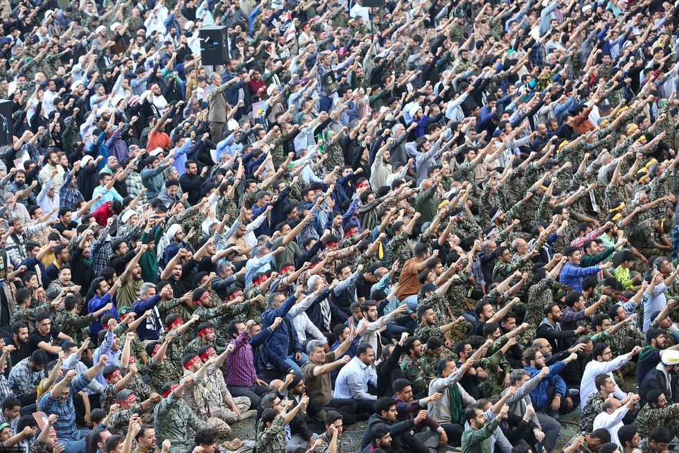 Photo of a crowd saluting during Friday prayers in Tehran on Oct. 4