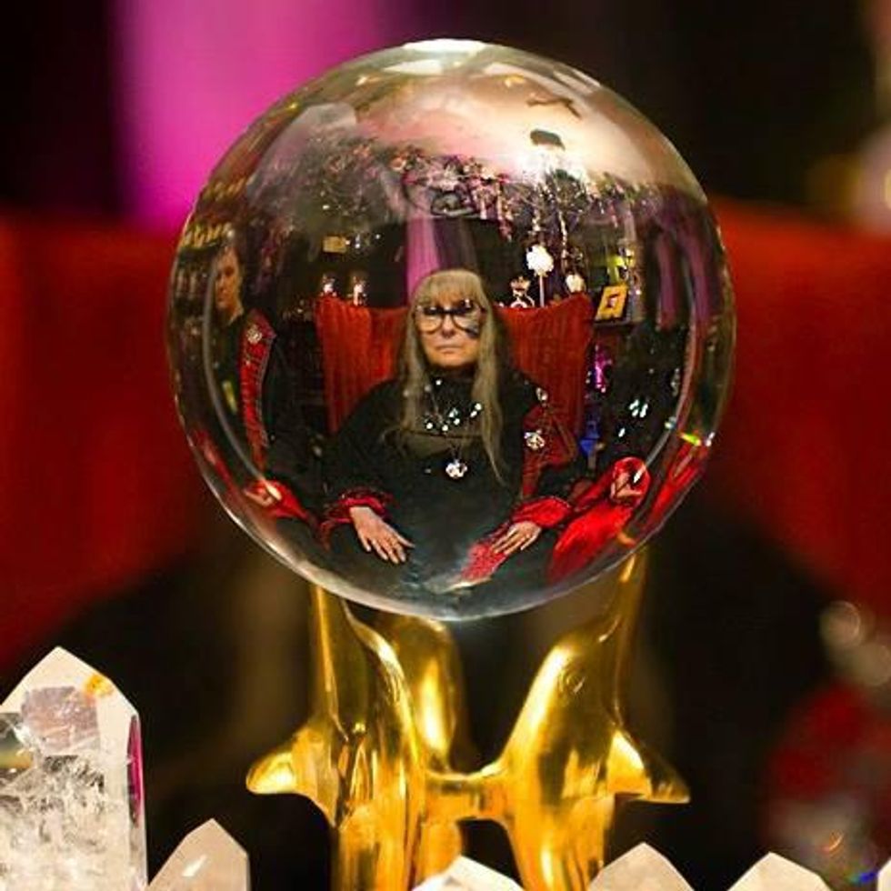 Photo of a crystal ball with a reflection of ​Laurie Cabot, also know as the Official Witch Of Salem