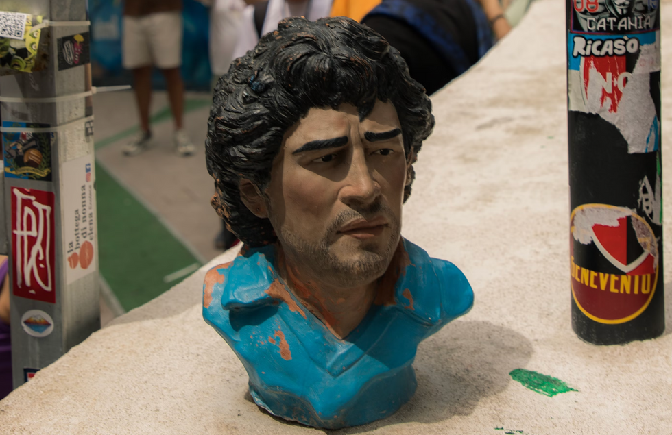 Photo of a decrepit vintage bust of Argentine soccer icon Maradona