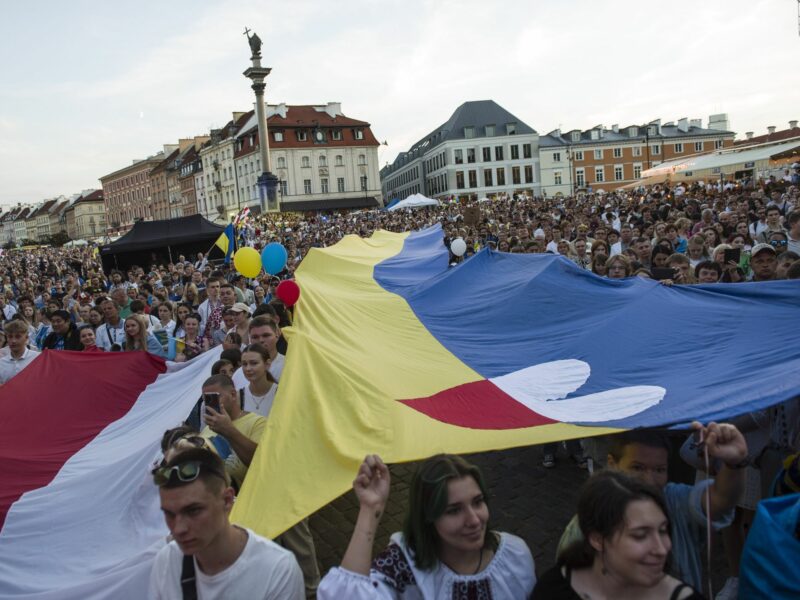 photo of a demonstration with polish and ukrainian flags