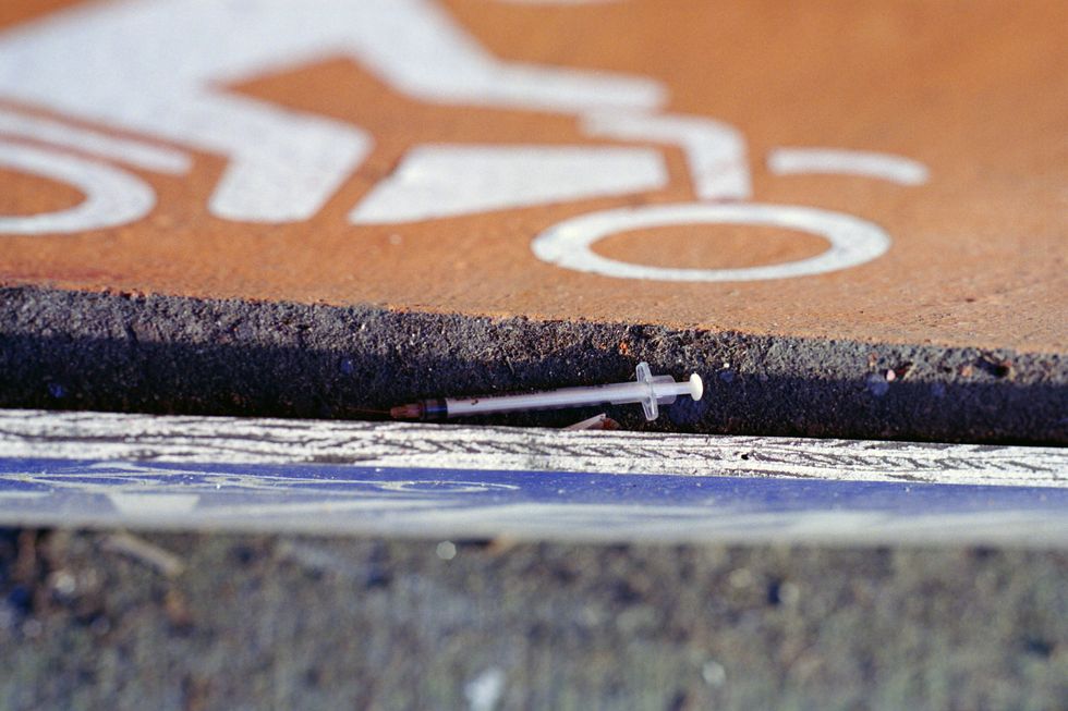 Photo of a discarded syringe on the ground in Vancouver, Canada