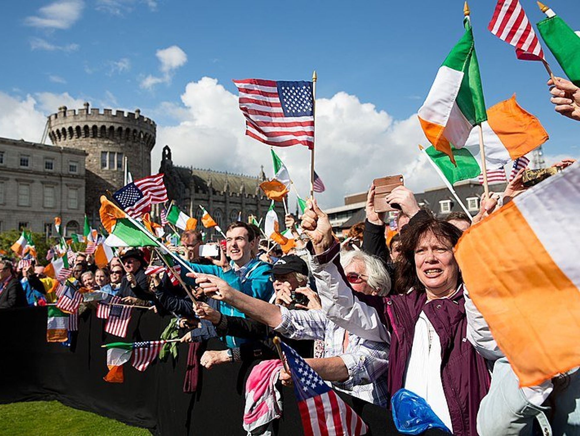 Photo of a ​crowd flying U.S. and Irish flags as they greet then Vice President Joe Biden during a state visit to Dublin in June 2016