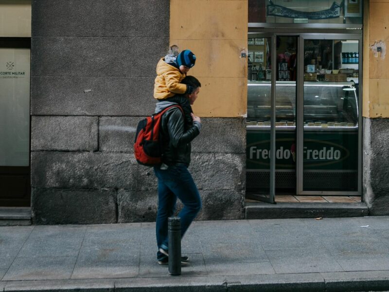Photo of a father with a son on his shoulders