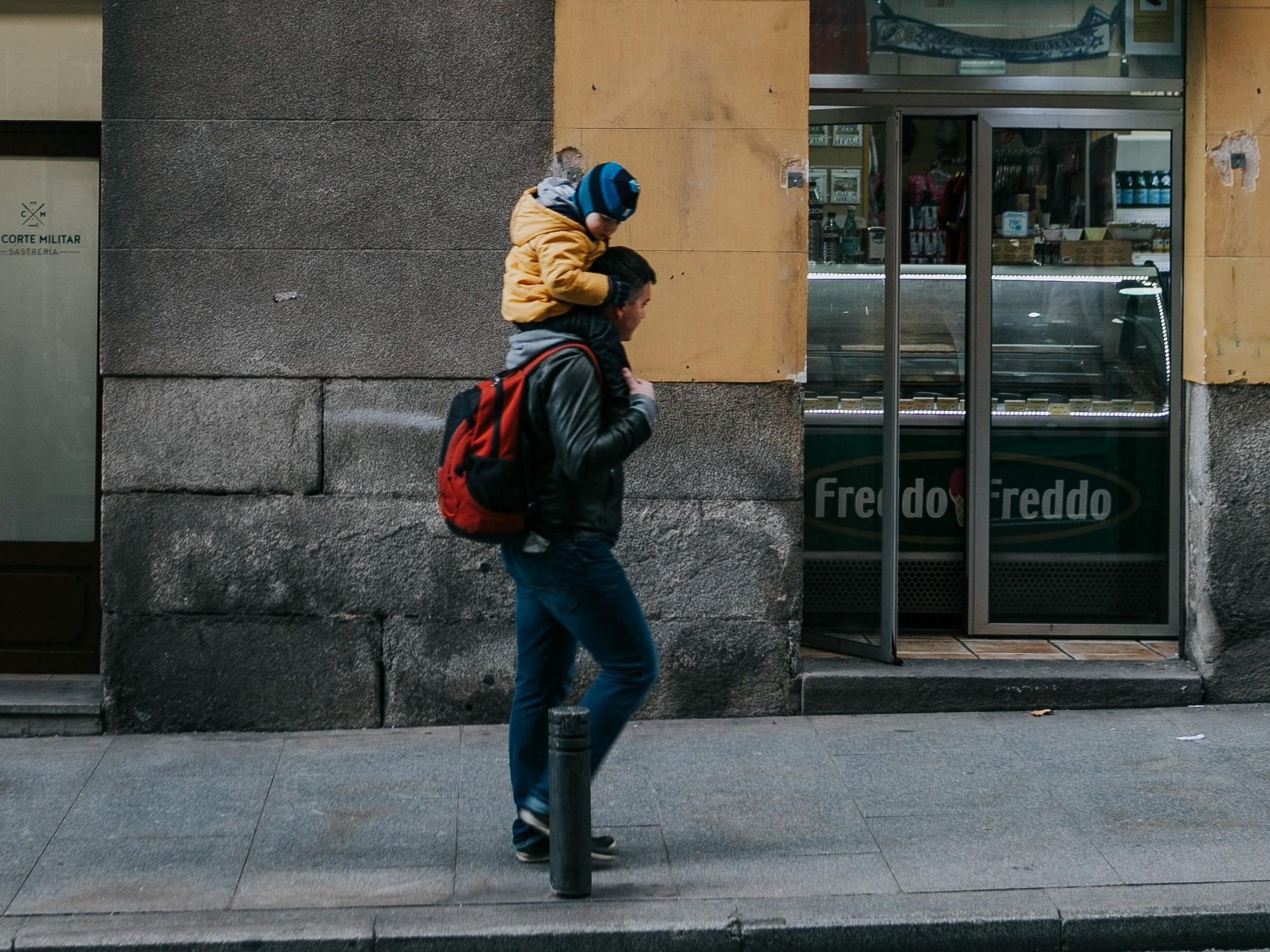 Photo of a father with a son on his shoulders