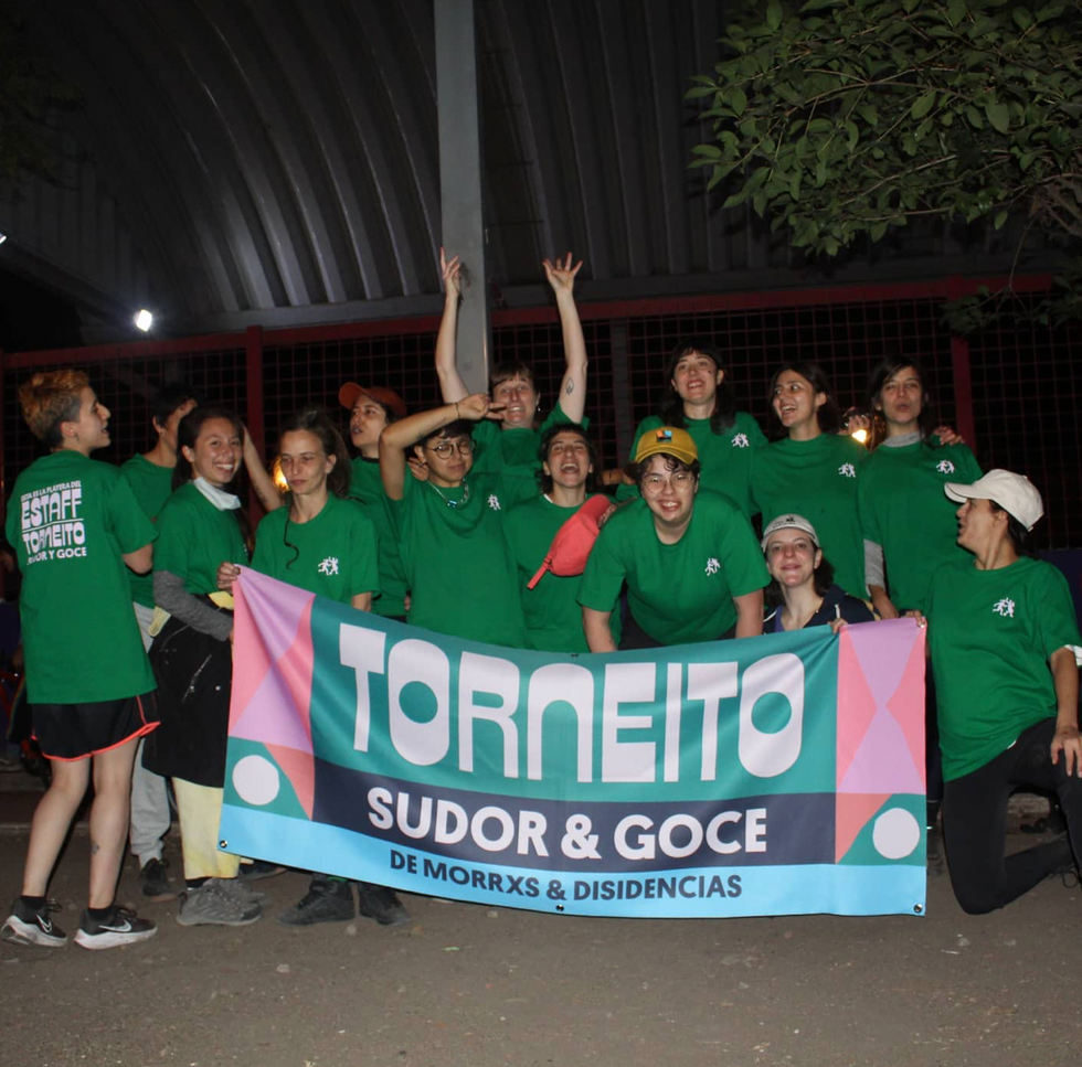 Photo of a football team holding their flag