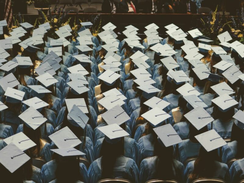 Photo of a graduation ceremony showing the students' hats.