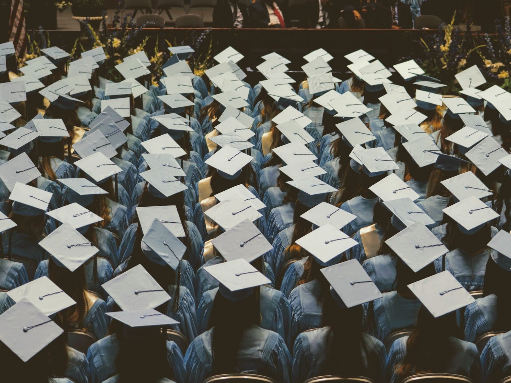 Photo of a graduation ceremony showing the students' hats.
