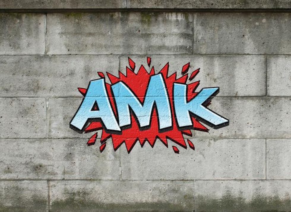 Photo of a graffiti displaying AMK, short for "amına koyim,” a phrase that made its way into German slang and is meant as an insult to one's mother.
