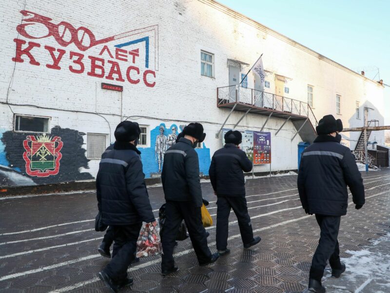 Photo of a group of ​prisoners walking inside a penal colony in Mozzhukha, Russia
