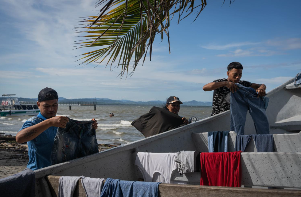 Photo of a group of people put their clothes out to dry.