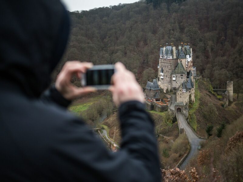 Photo of a hiker taking a picture of Eltz Castle near Wierschem, Germany, 04 March 2016.