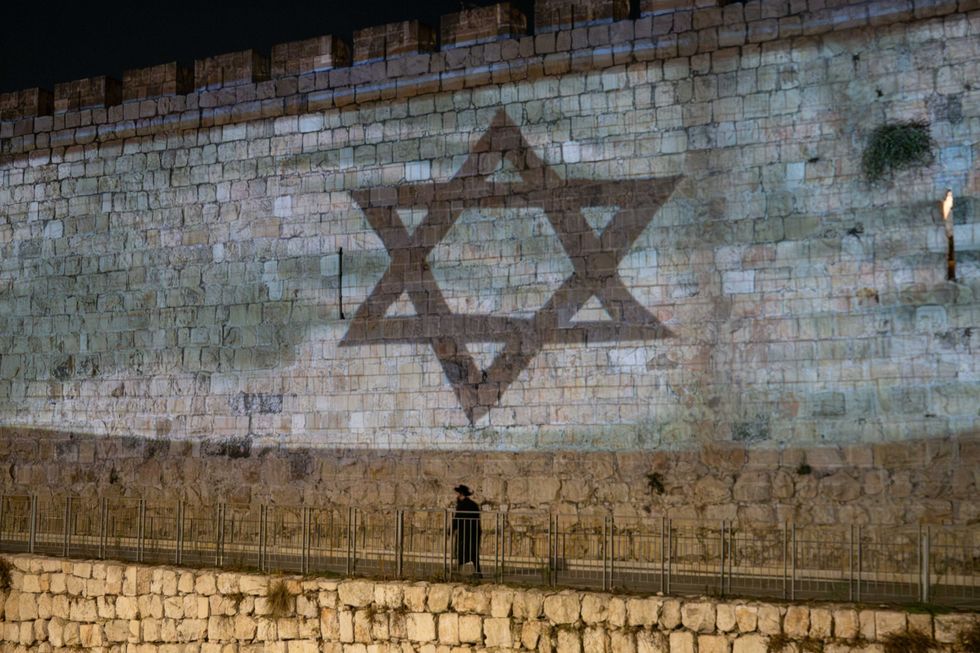 photo of a jewish star on the ancient walls of Jerusalem