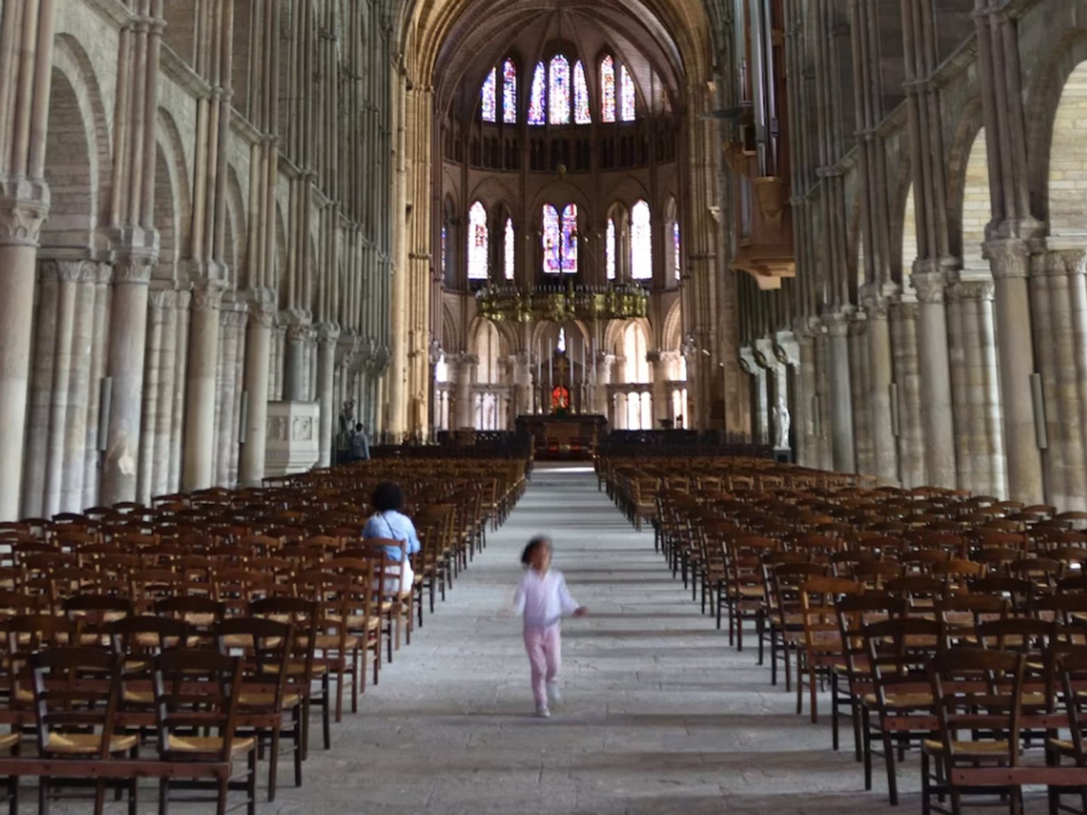 photo of a kid running out of a church