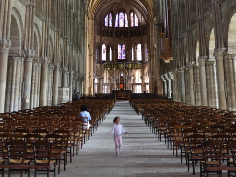 photo of a kid running out of a church