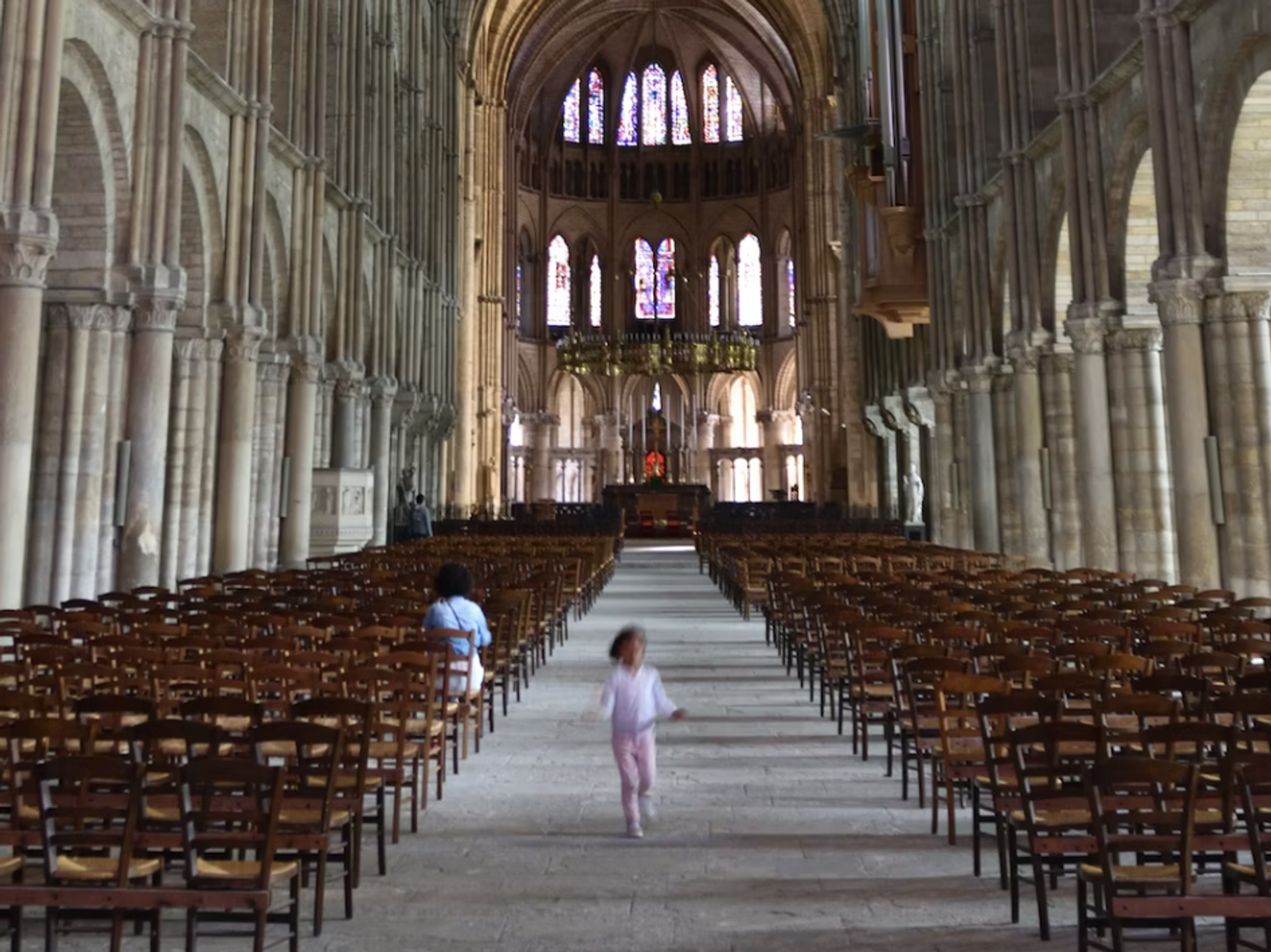 photo of a kid running out of a church