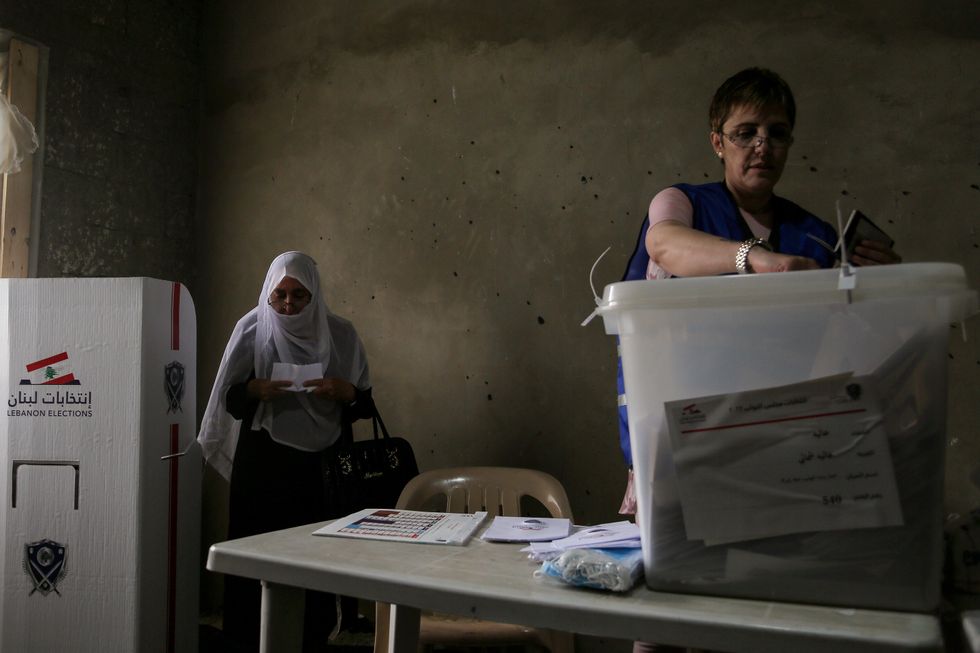 Photo of a Lebanese woman casting her vote during the 2022 Lebanese parliamentary election