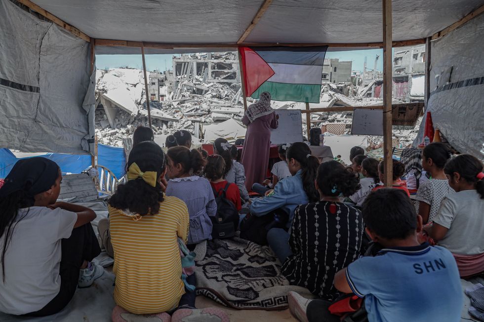 Photo of a makeshift school among the rubble in Gaza.