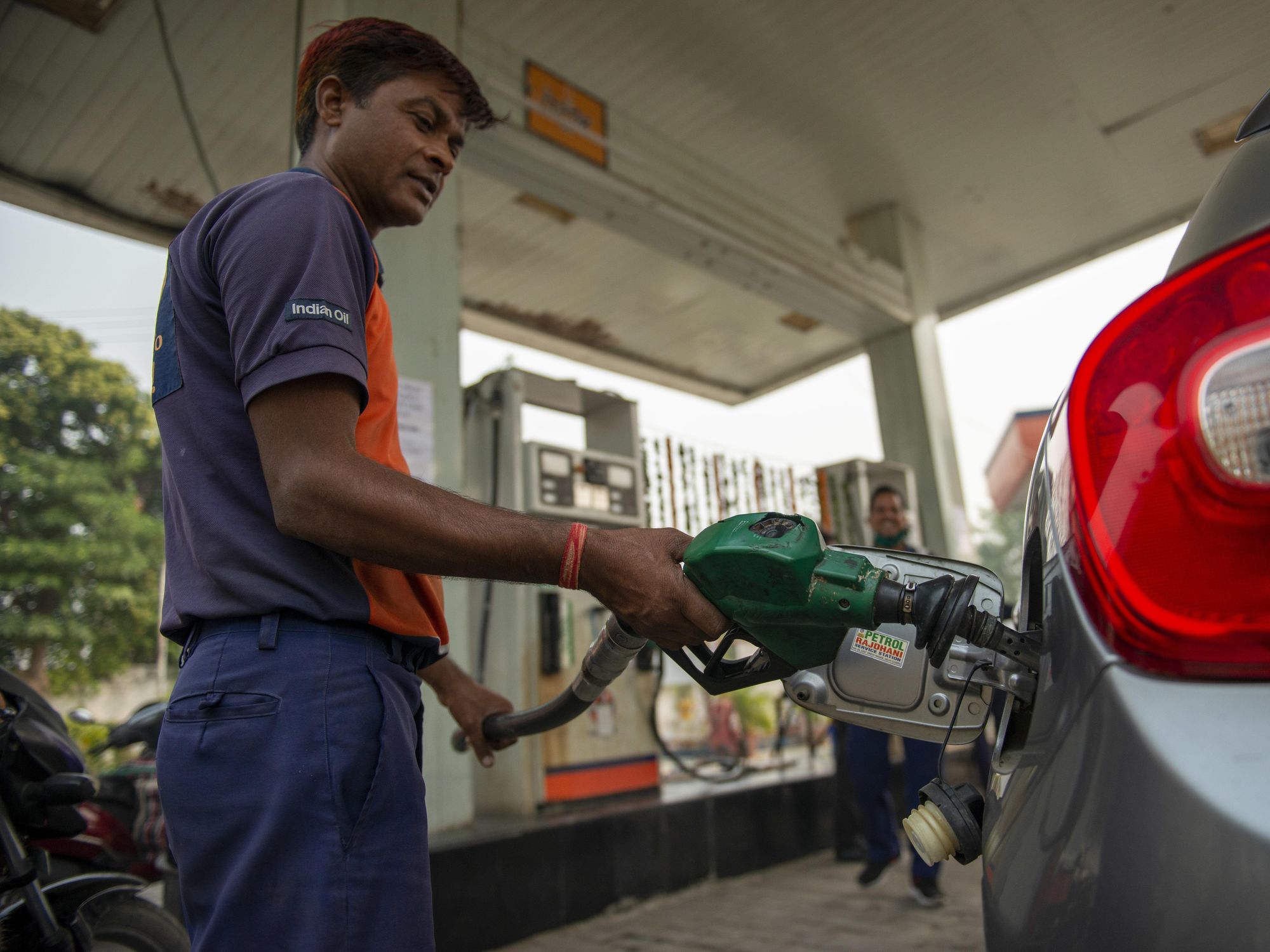 Photo of a man at a gas station in Ghaziabad, India.